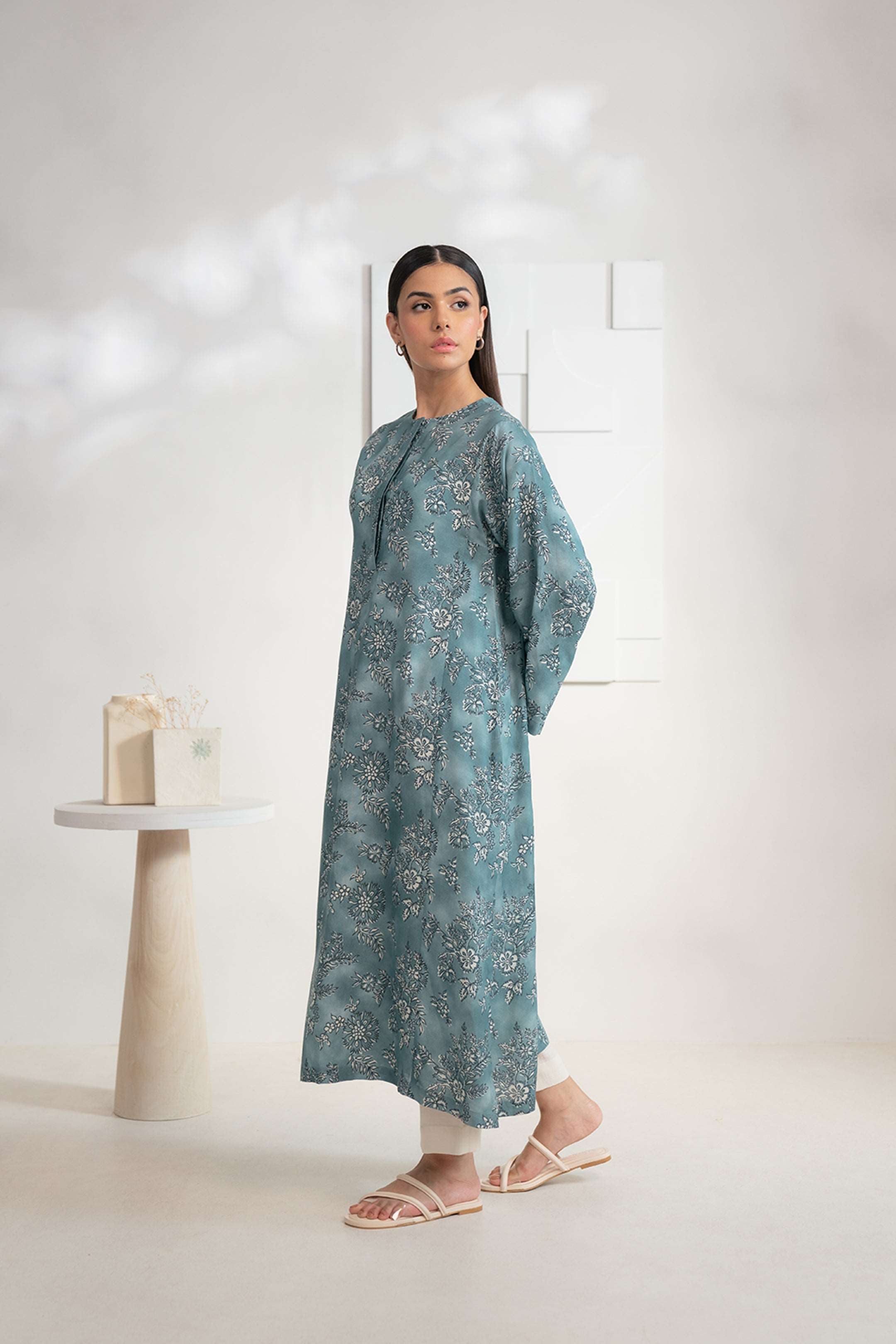 Women’s teal Karandi shirt with floral design, shop this stylish piece online now