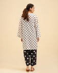 Women’s two piece cambric suit – chic polka dot design in black & white.