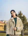 Women wearing beige sherpa fleece jacket for winter layering