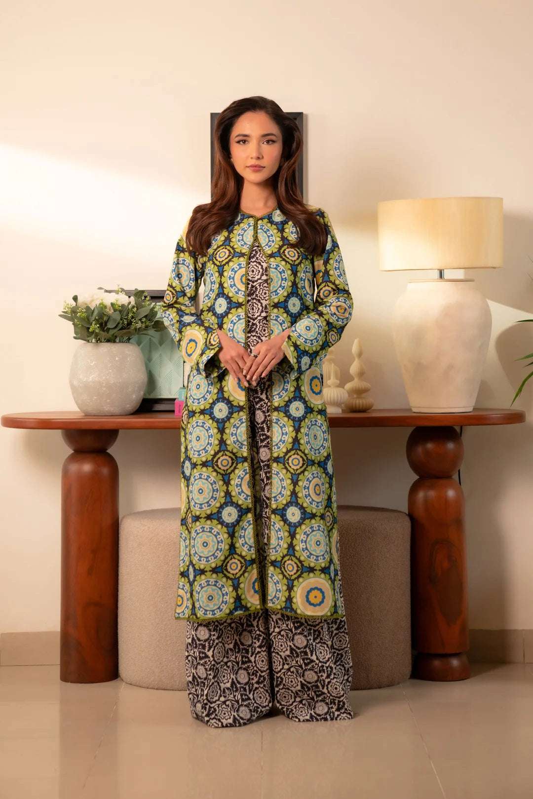 2 piece printed cambric suit – green abstract design shirt with black and white floral trousers for an elegant look.
