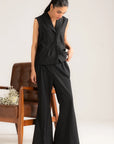 Angled front view of black 2 piece vest set with tailored top and wide-leg trousers