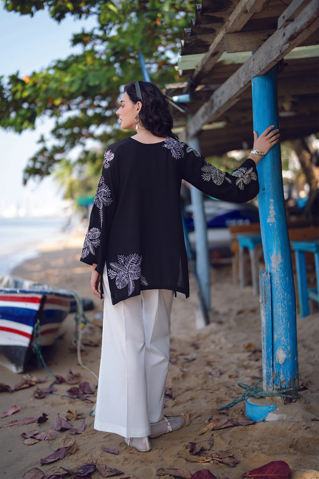 Angled pose of black embroidered ready-to-wear linen shirt for smart casual wear