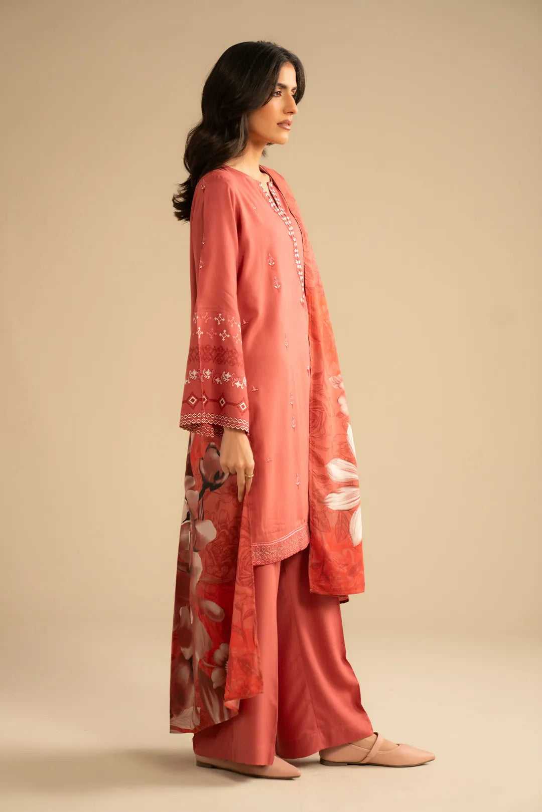 Back/side angle showing the shawl length and how the suit drapes from shoulder to hem.