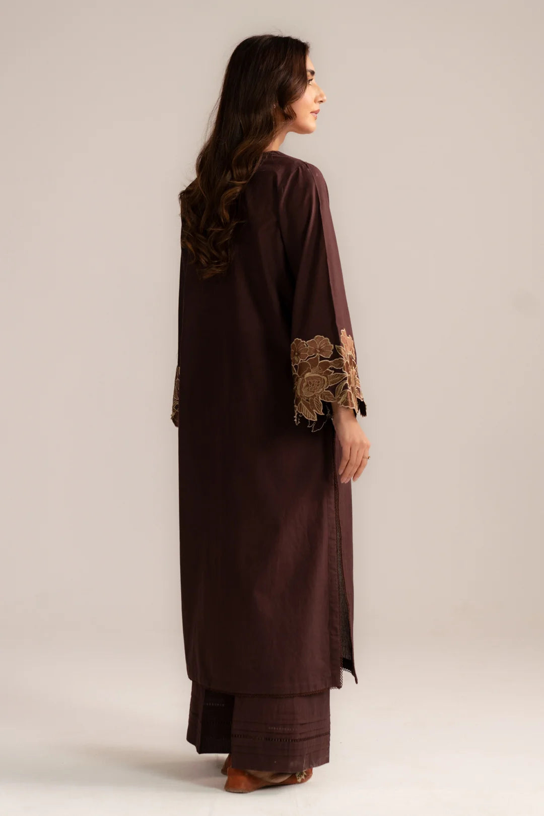 Back view of dark brown cambric 2 piece suit with embroidery accents