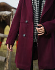 Back view of maroon winter coat for women, knee-length hemline