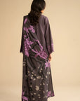 Back view of purple linen suit with printed shawl draped, showing overall silhouette