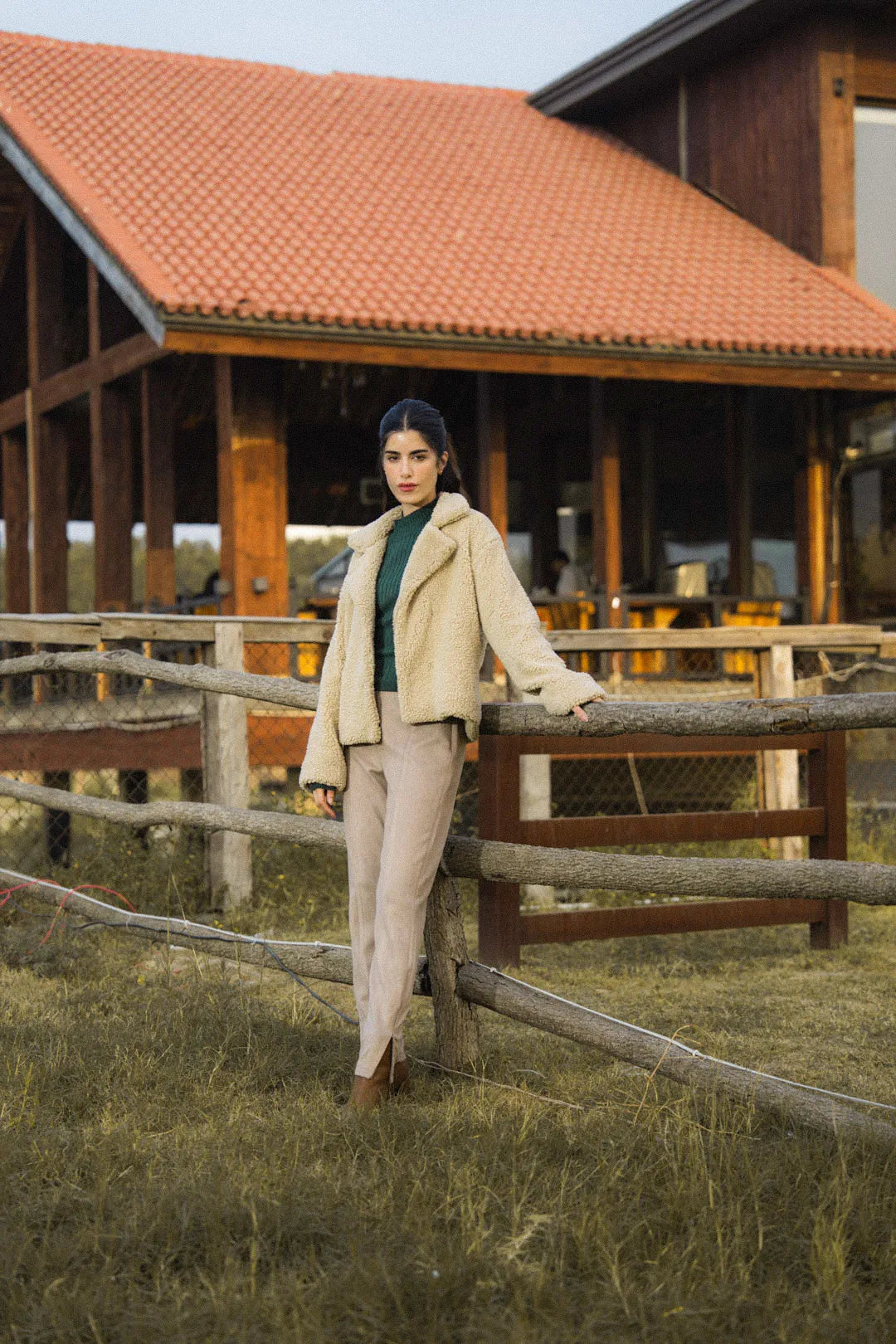 Beige sherpa fleece jacket styled for Pakistan winter wardrobes