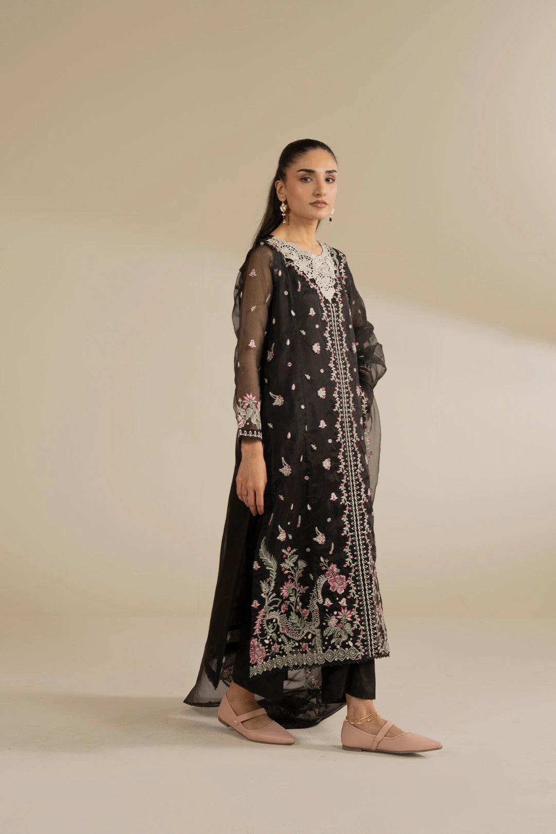 Black embroidered organza outfit close framing to emphasize delicate threadwork and luxe finish.