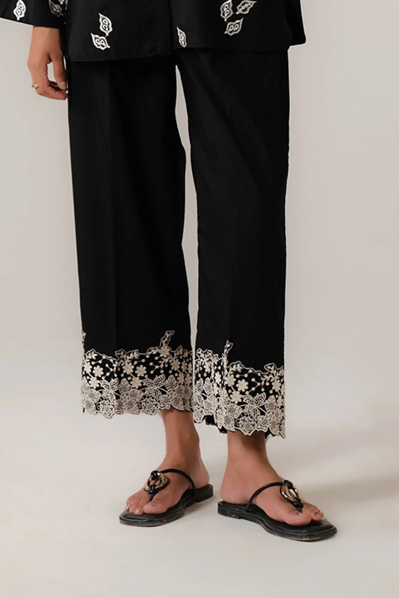 Black embroidered trouser with white lace detailing for women in Pakistan