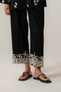 Black embroidered trouser with white lace detailing for women in Pakistan