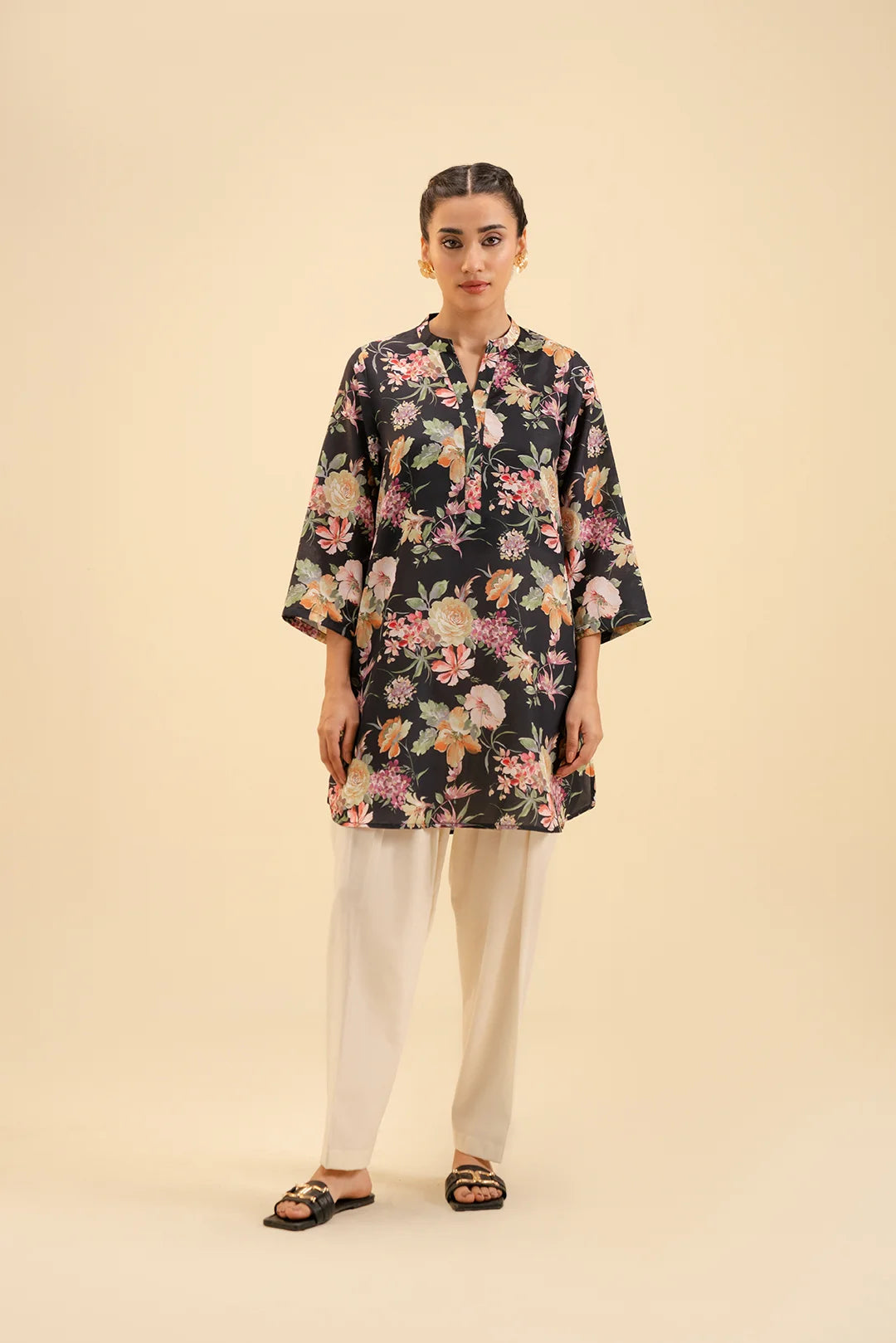 Black floral cambric shirt for women – trendy and elegant Pakistani kurti.