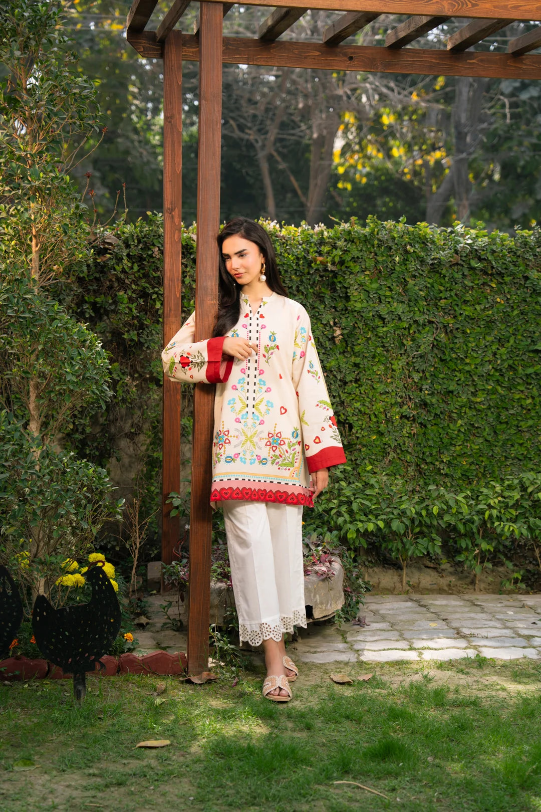 Breathable cambric pret kameez women white trousers wood pergola garden setting full length