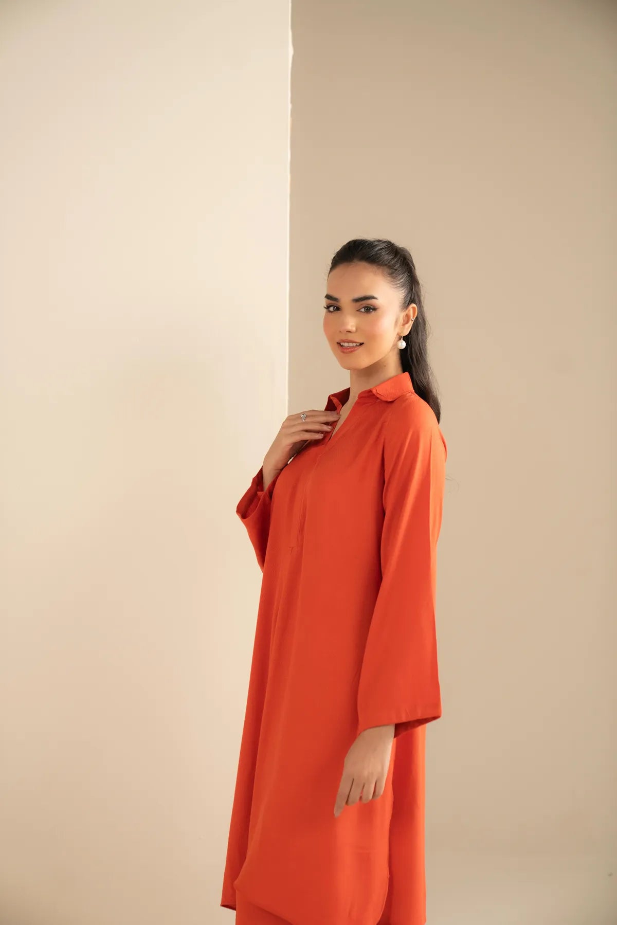 Bright orange two-piece set styled for everyday comfort