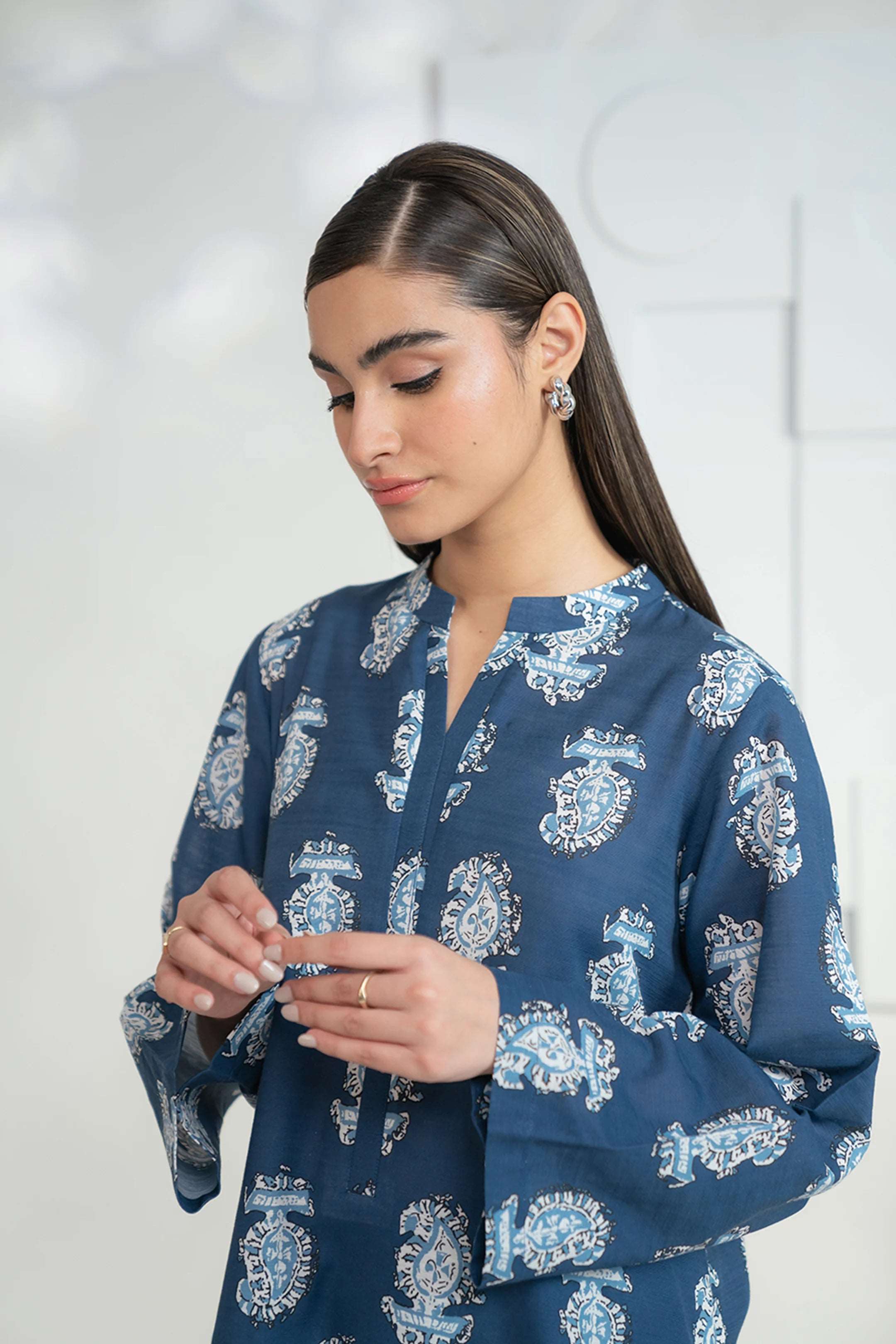 Buy online 2-piece printed khaddar suit for daily wear and events.