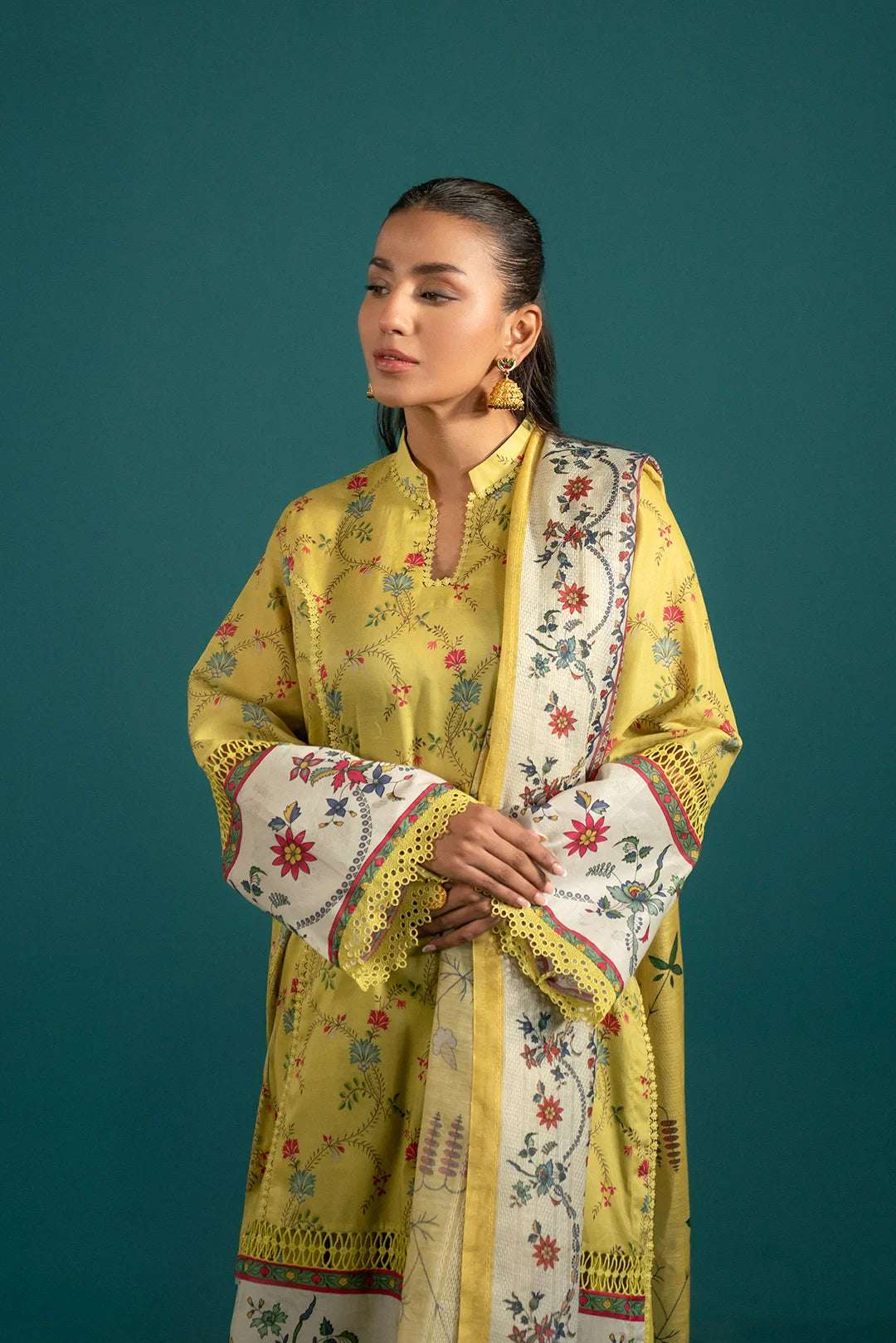 Chic Yellow Lawn Suit for Women in Pakistan: Elevate your wardrobe with this eye-catching Pakistani lawn suit, featuring a digitally printed shirt, comfortable cambric trousers, and a contrast dupatta.