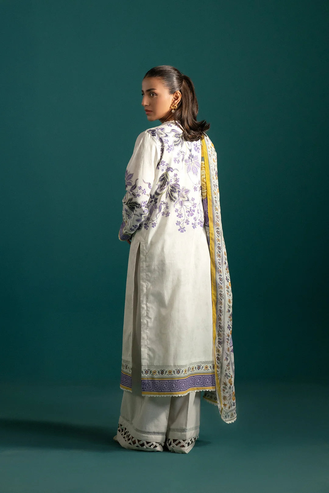 Classic lawn suit design with a venom green and purple pattern on an ash white base, complemented by a beautifully detailed chiffon dupatta.