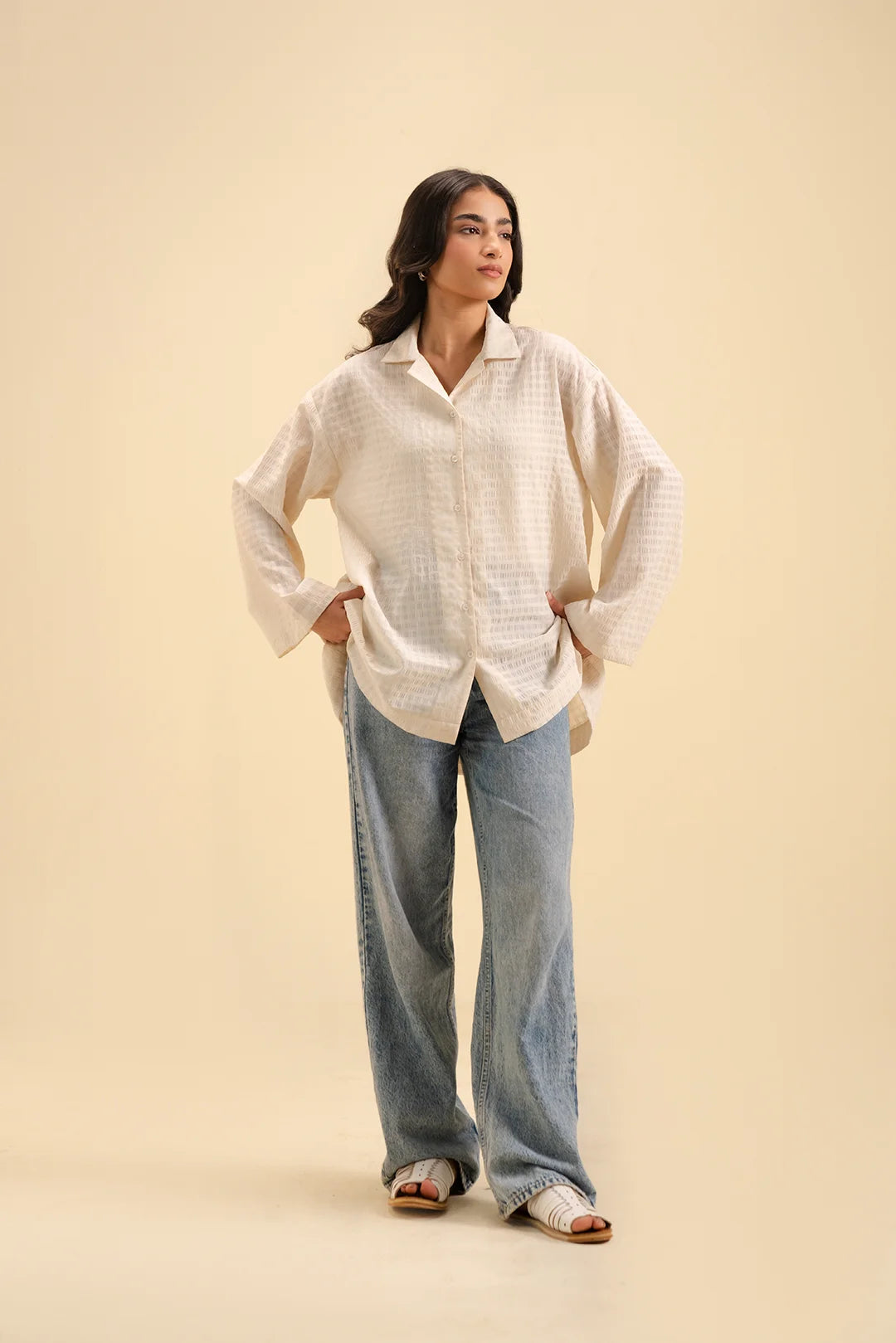 Classic off-white button-down shirt – versatile casual and formal wear for women.