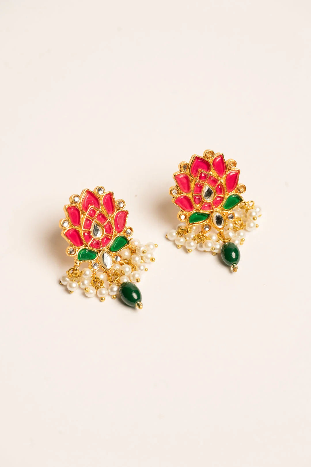 Close-up lotus chandbali earring red center green petal stone detail pearl latkan traditional Pakistani