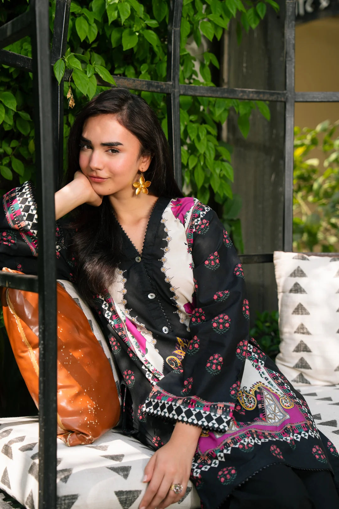 Close-up of black floral printed women kurti in cambric fabric