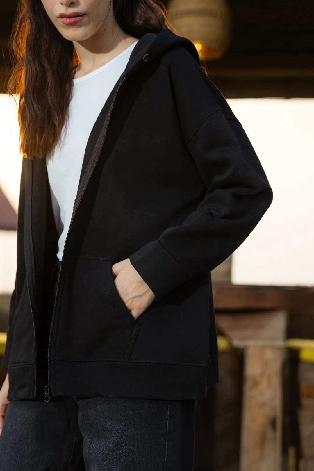 Close-up of black hoodie front opening and fabric texture