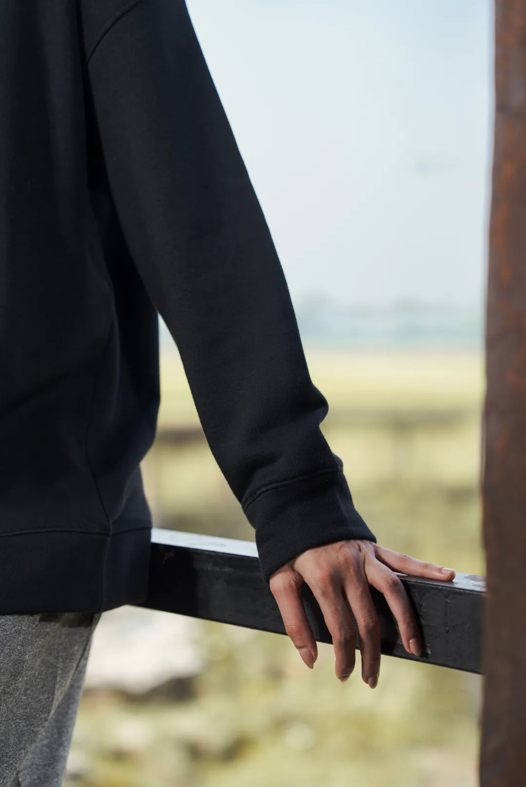 Close-up of black sweatshirt sleeve and cuff detail