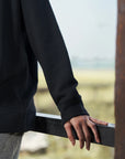 Close-up of black sweatshirt sleeve and cuff detail