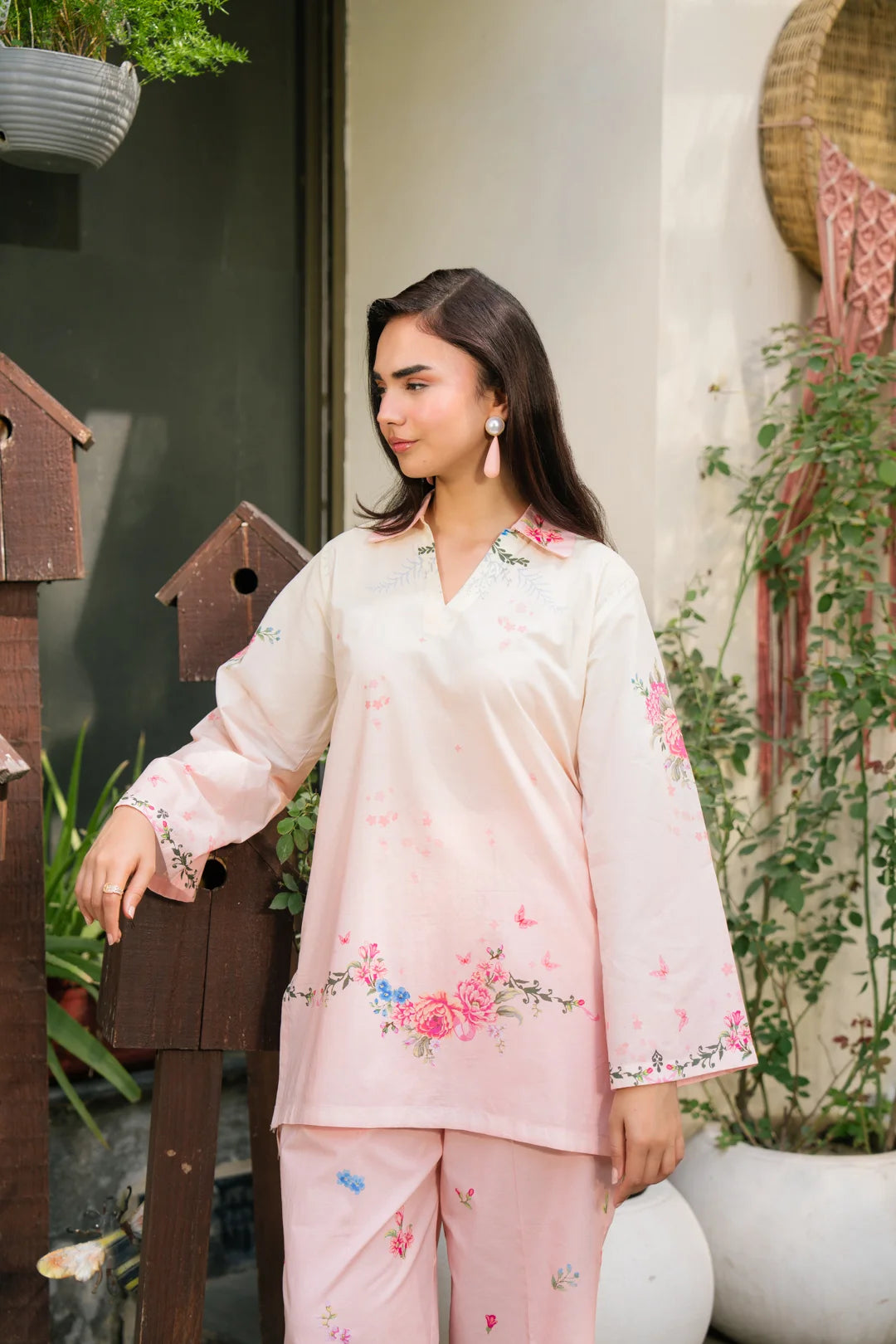 Close-up of blush pink printed silk shirt for women