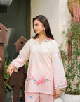 Close-up of blush pink printed silk shirt for women