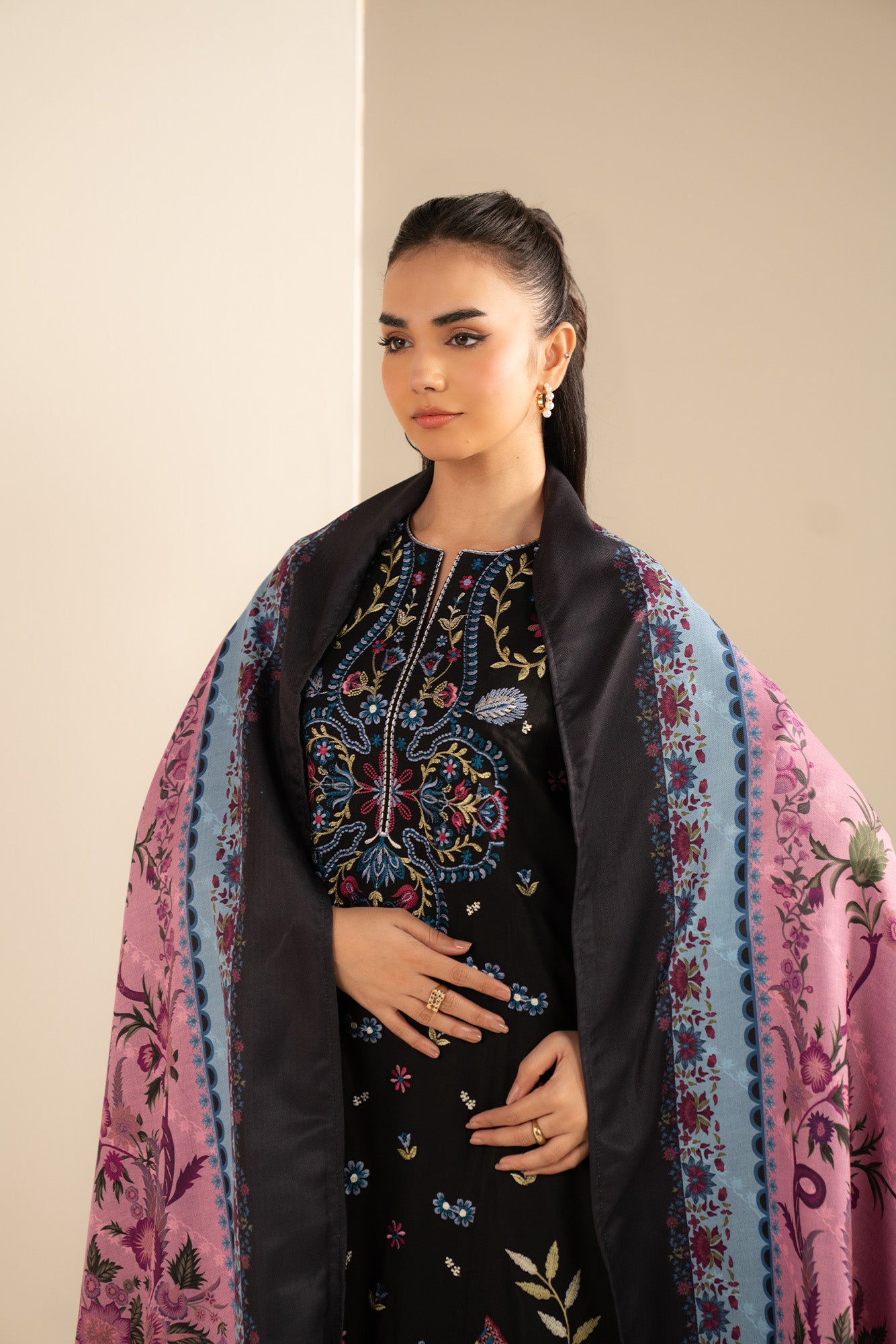 Close-up of embroidered Marina shirt panels showing detailed threadwork on the front.