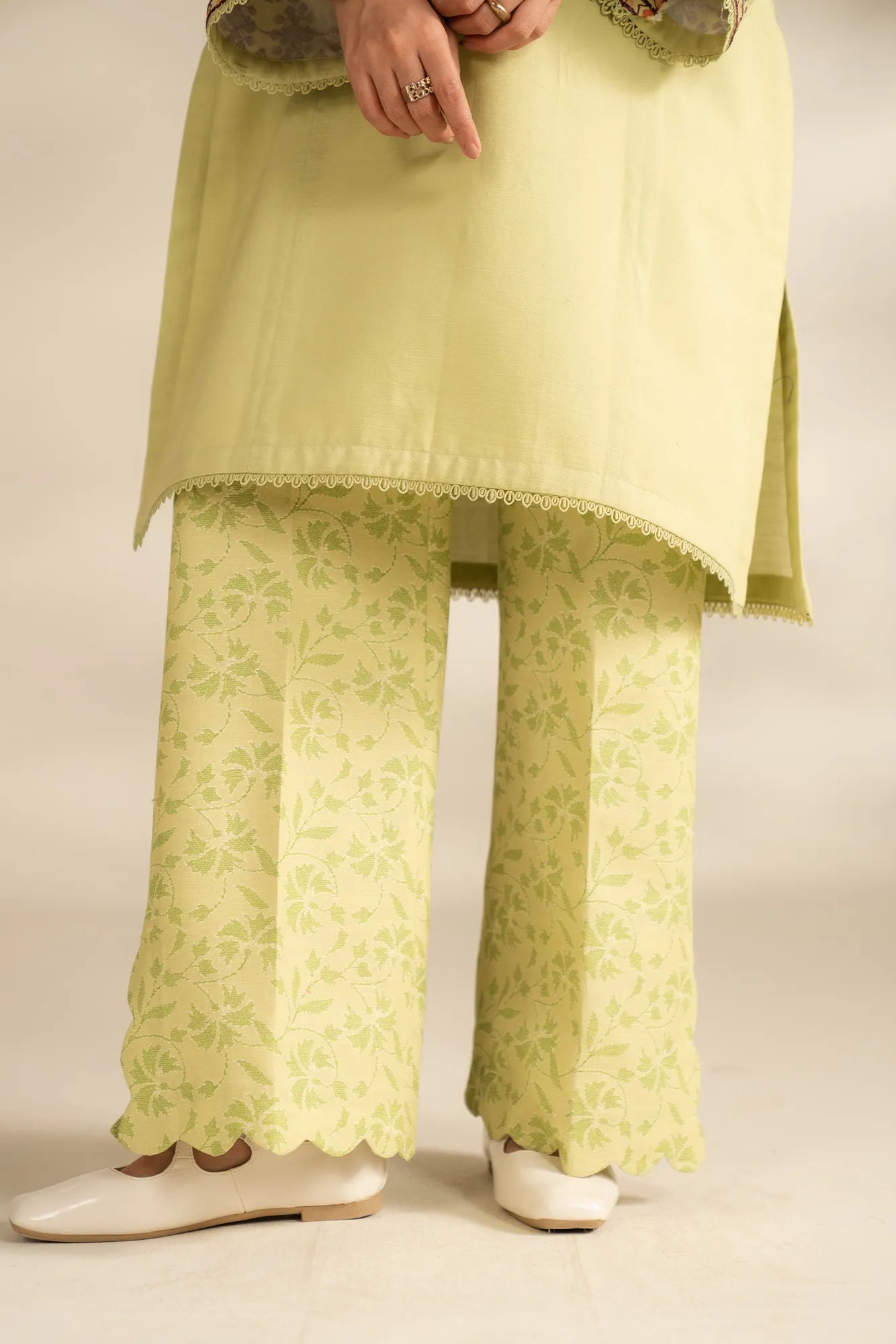 Close-up of embroidered neckline detailing on khaddar shirt for women