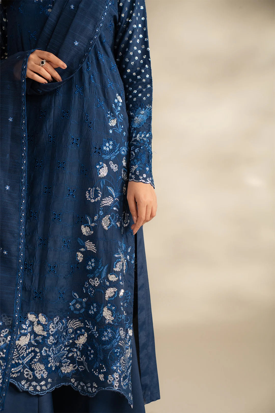 Close-up of embroidered raw silk shirt in midnight blue