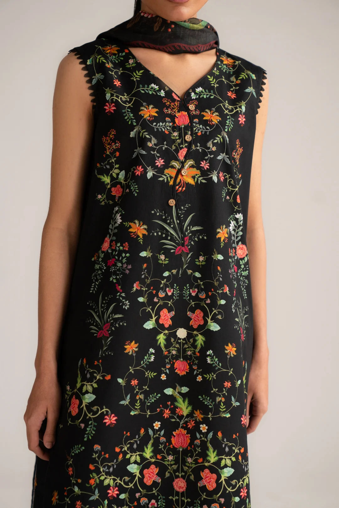 Close-up of floral print detail on black lawn shirt