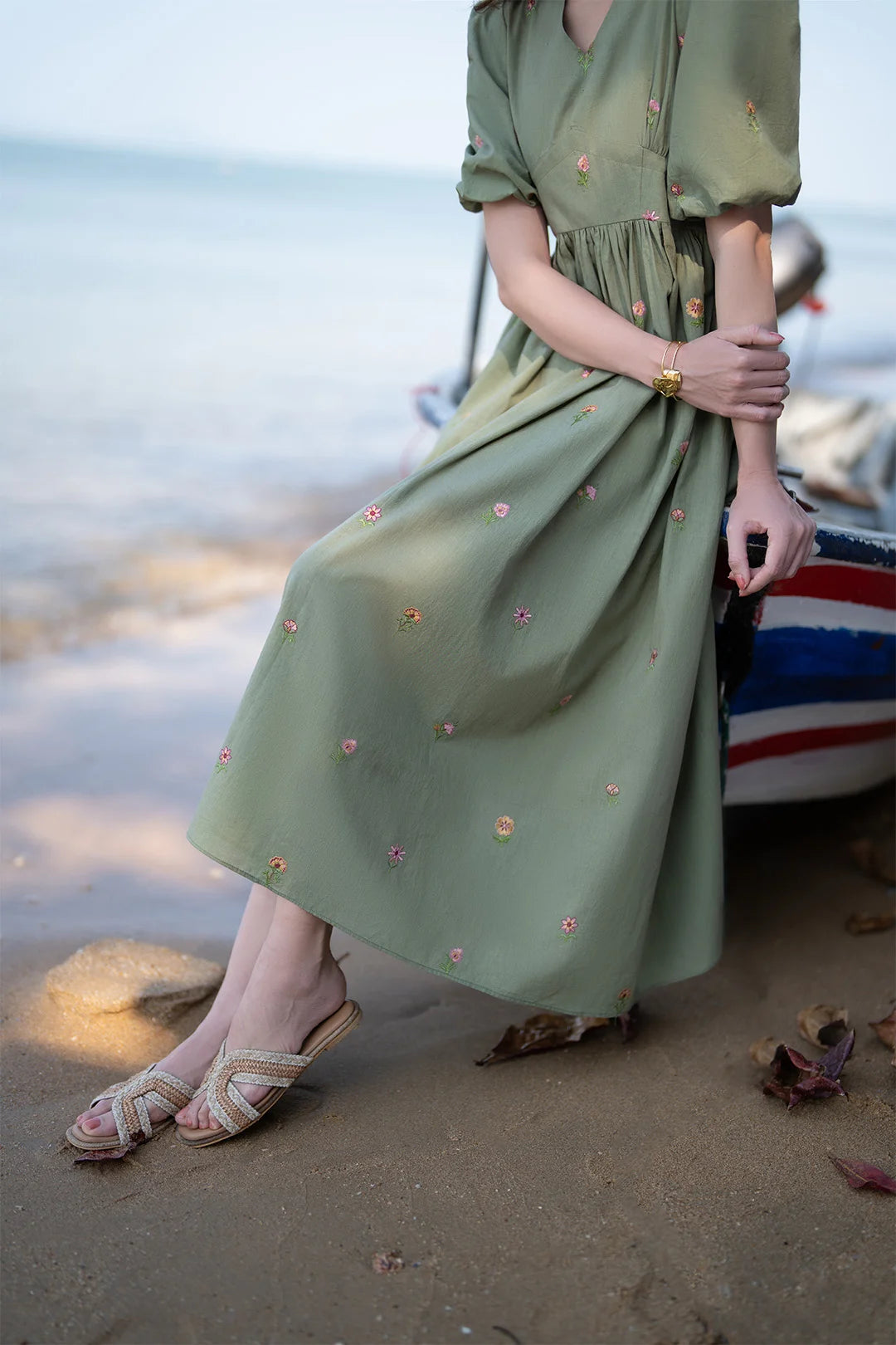 Close-up of green embroidered cambric fabric