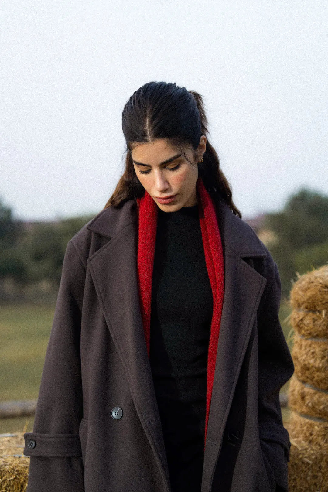 Close-up of lapel and front opening on dark grey winter overcoat