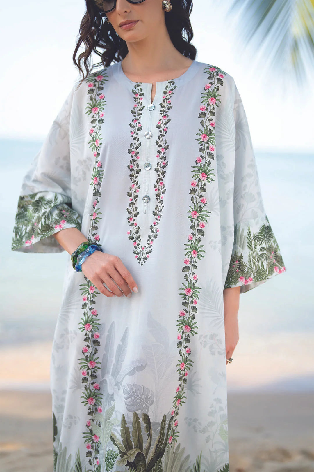 Close-up of light blue printed lawn kaftan fabric and front detailing