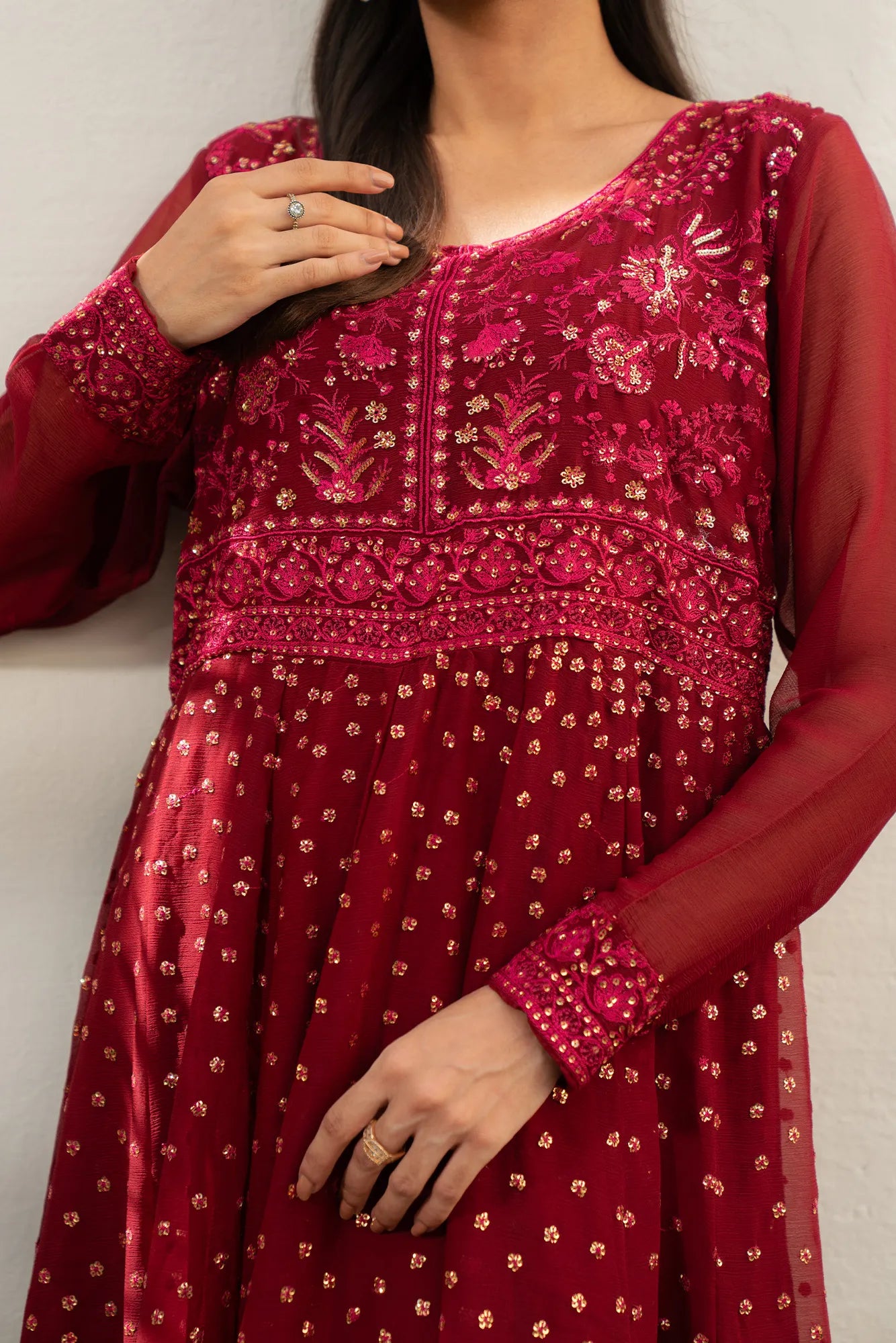 Close-up of maroon embroidered chiffon shirt detailing on front panel