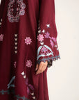 Close-up of maroon linen shirt embroidery and sleeve design