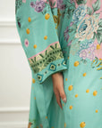 Close-up of mint green print and sleeve detail on printed raw silk kaftan
