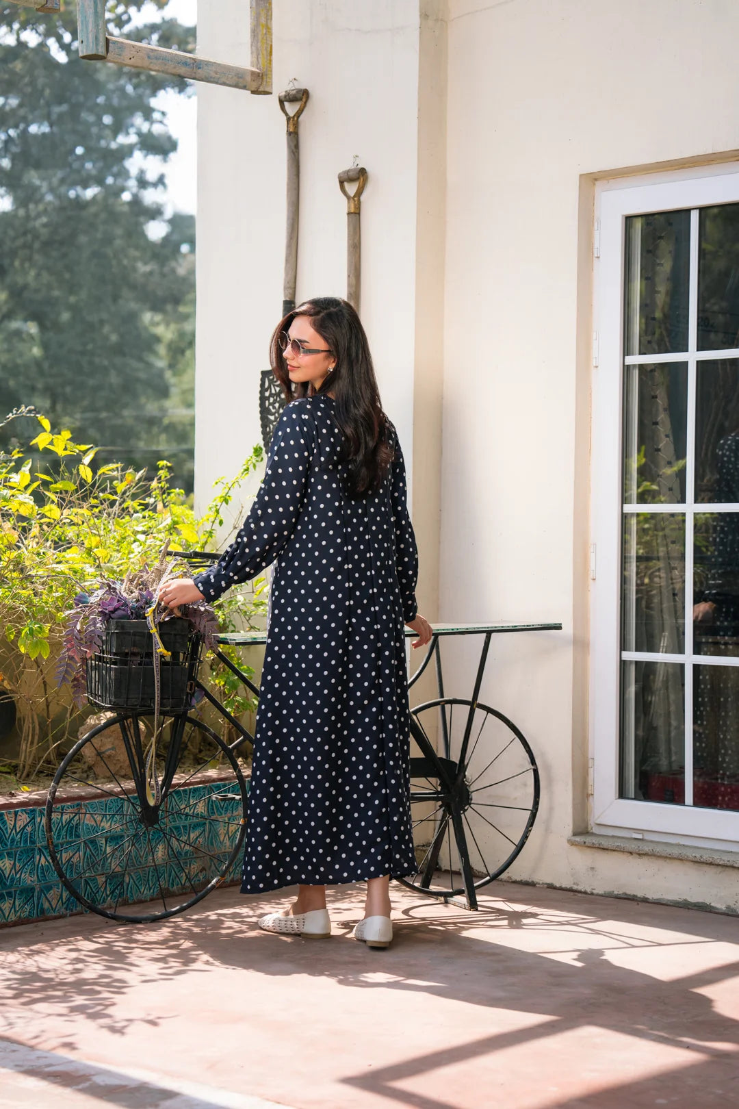 Close-up of navy blue polka dot dress fabric and print