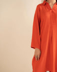 Close-up of orange long top co-ord with clean neckline detail