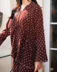 Close-up of polka dot silk shirt in chocolate brown