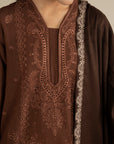 Close-up of the outfit neckline with the dark brown shawl layered, highlighting texture and contrast.