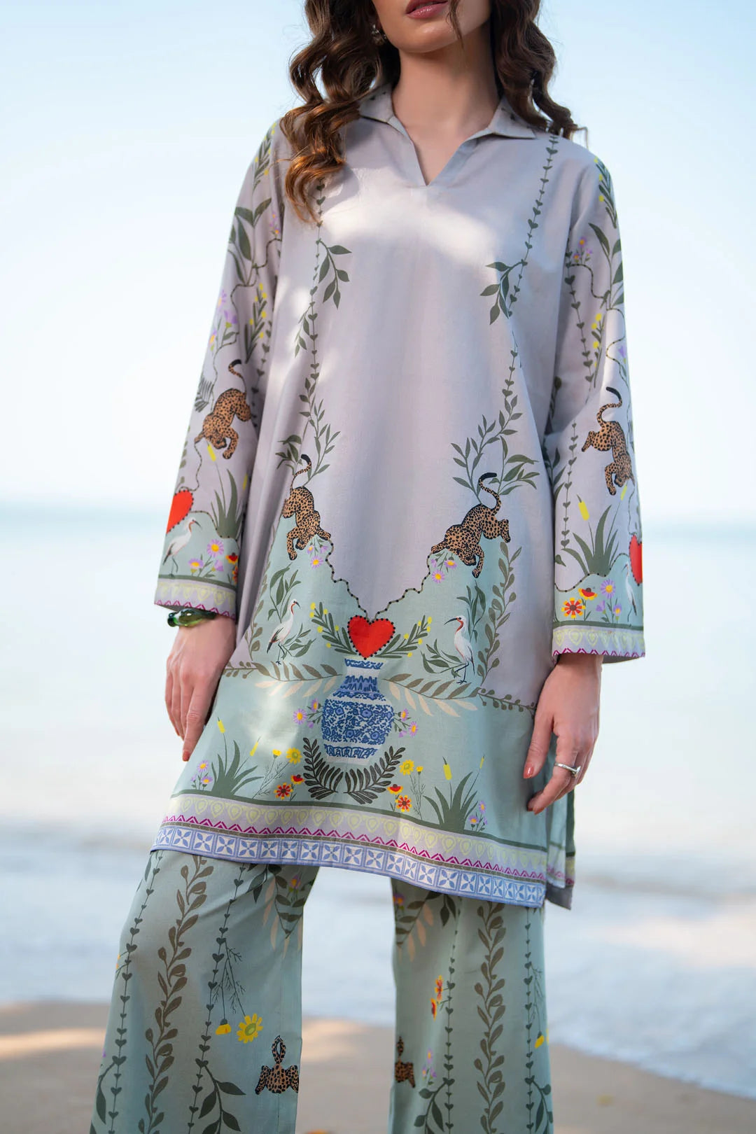 Close-up of women’s grey printed shirt with multicolor border detail