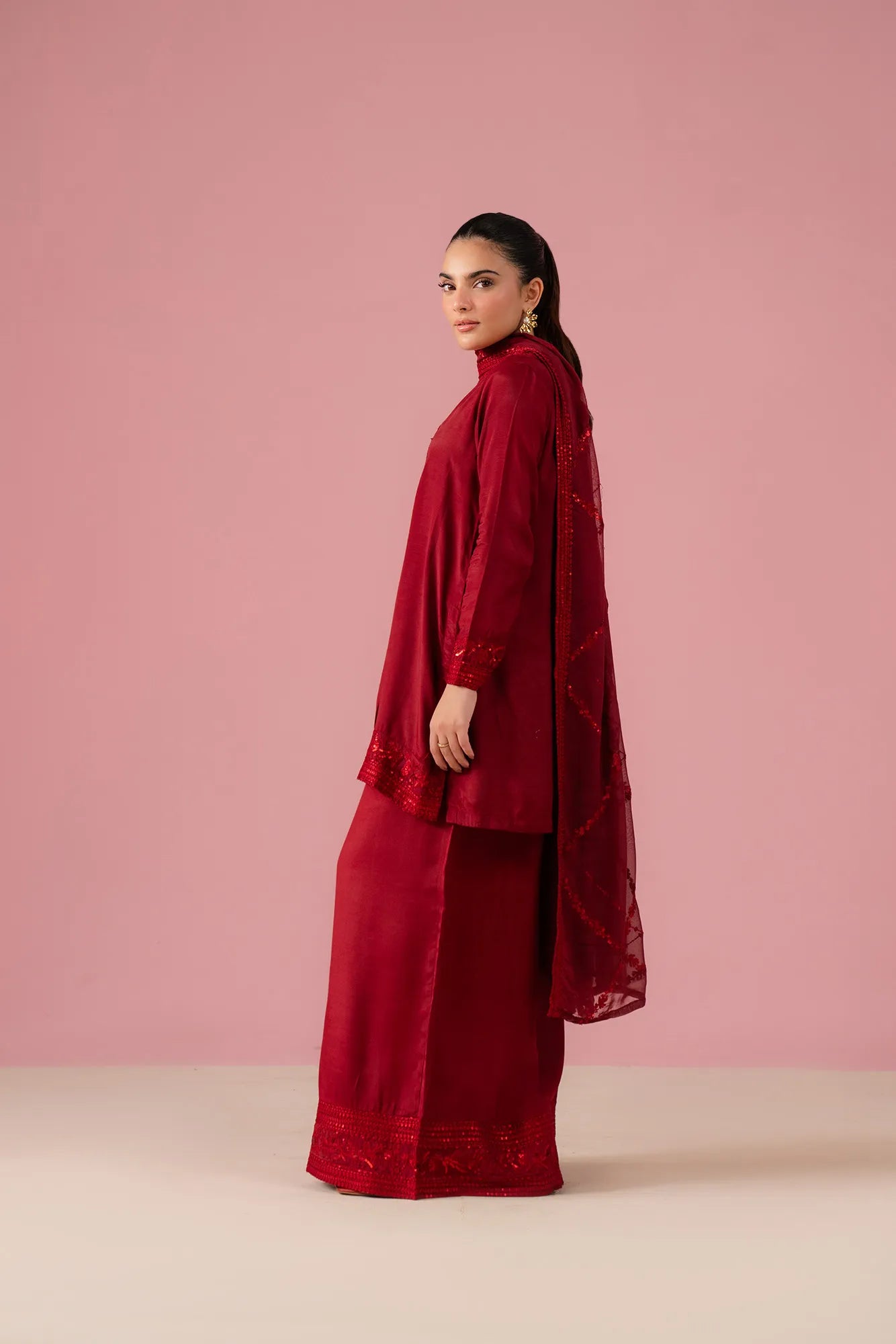 Crimson embroidered raw silk Pakistani suits for weddings