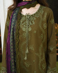 An olive green embroidered kurta with a matching purple dupatta, shown on a model. The kurta features light green floral embroidery, a round neckline with a decorative tassel tie, and lace-trimmed cuffs.