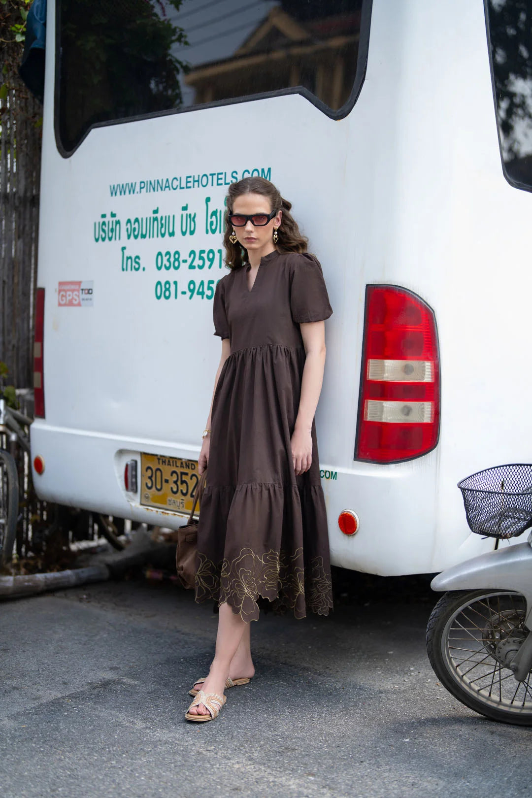 Hem embroidery detail of dark brown cambric long frock