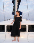 Women wearing black cambric frock midi length - casual evening wear