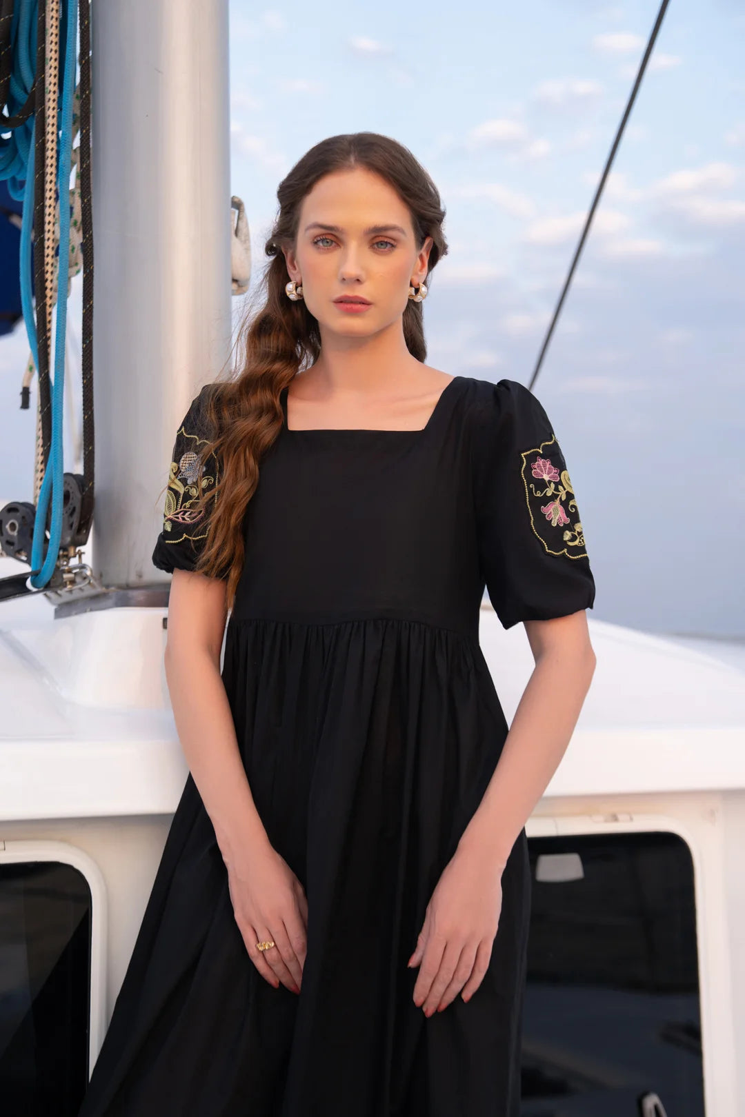 Black cambric midi frock side view - women festive wear