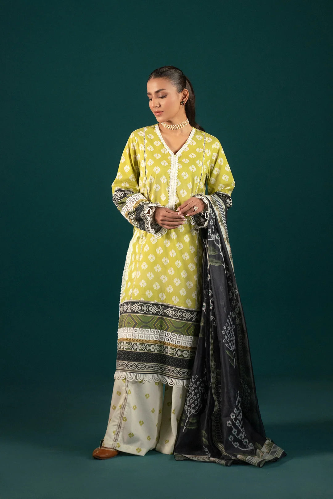 Elegant 3 Piece Lawn Suit - Olive Green & Black Dupatta: A stylish printed lawn suit featuring an olive green shirt with intricate chunri motifs, paired with cambric trousers and a printed monark dupatta.