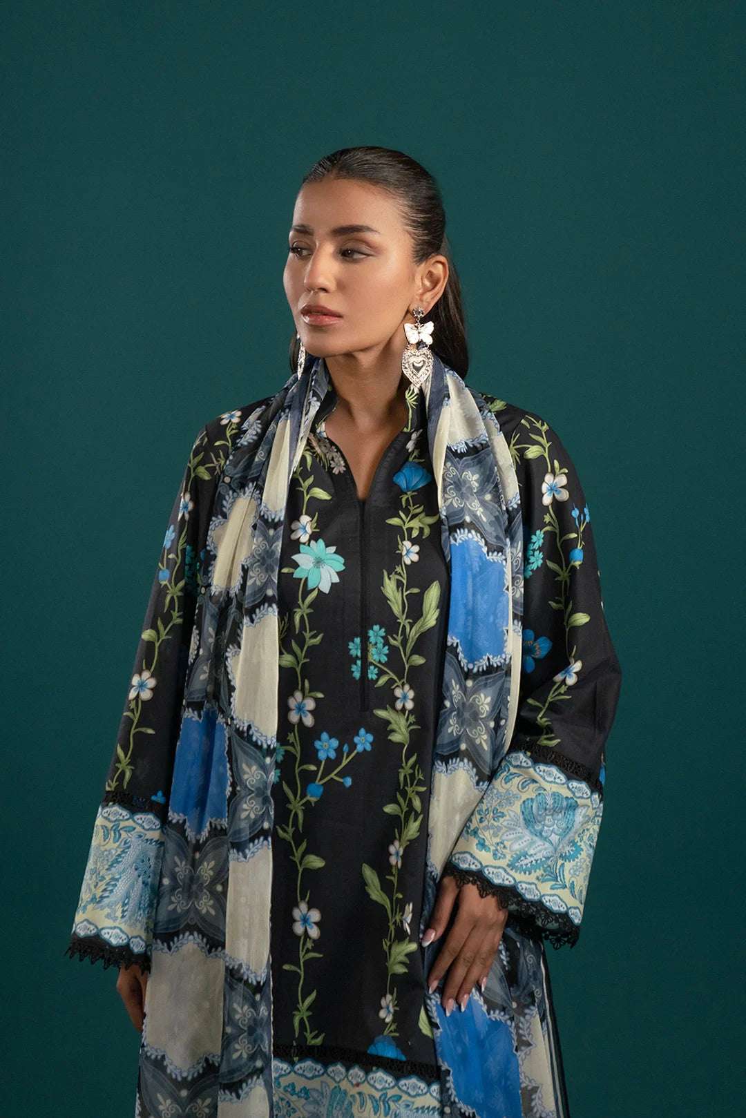 Elegant lawn suits collection – this black lawn outfit with intricate floral embroidery and a digitally printed chiffon dupatta offers a graceful and trendy look.